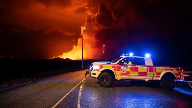 : An emergency vehicle is stationed on a road leading to volcanic activity between Hagafell and Stóri-Skógfell. Photo / AP
