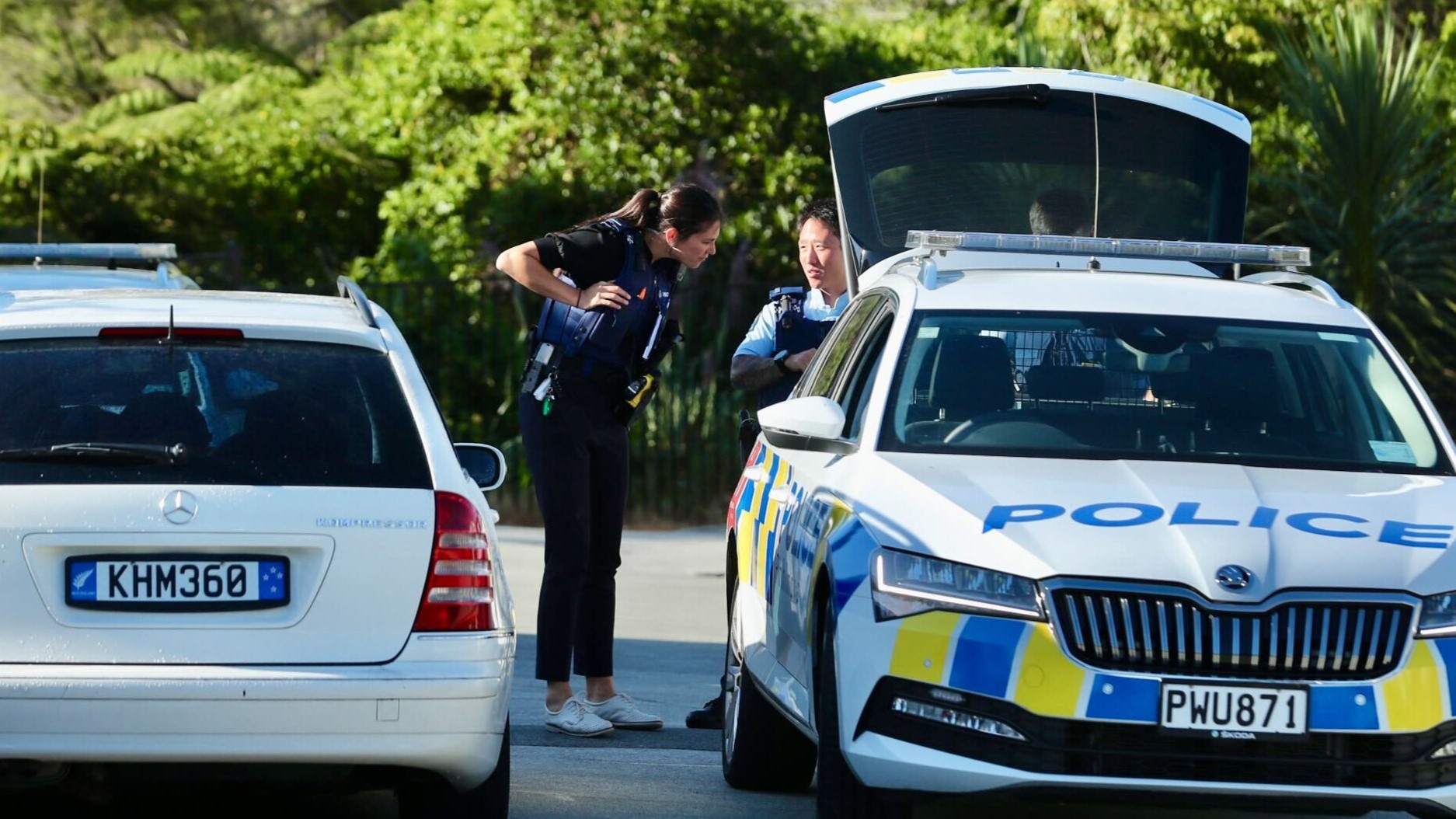Police at Akatarawa St Massey where offenders brandished firearms at the occupant of an address. Ambulance staff treated a male patient, but his injuries are unknown. Photo / Jason Dorday