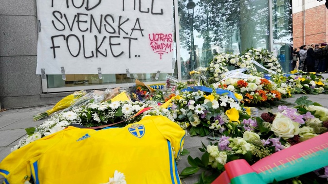 Police in Belgium on Tuesday shot dead a suspected Tunisian extremist accused of killing two Swedish soccer fans in a brazen attack on a Brussels street. Photo / AP