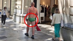 Arrest that man: The tourist was spotted in Palma de Mallorca wearing nothing but green trunks. Photo / Majorca Daily Bulletin