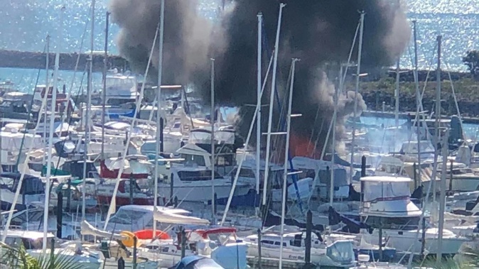 Boat on fire in Pine Harbour Marina. Photo / Angela Heenan