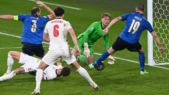 Italy's Leonardo Bonucci, right, scores his side's opening goal during the Euro 2020 final soccer match between Italy and England at Wembley stadium in London, Sunday, July 11, 2021. Photo / AP