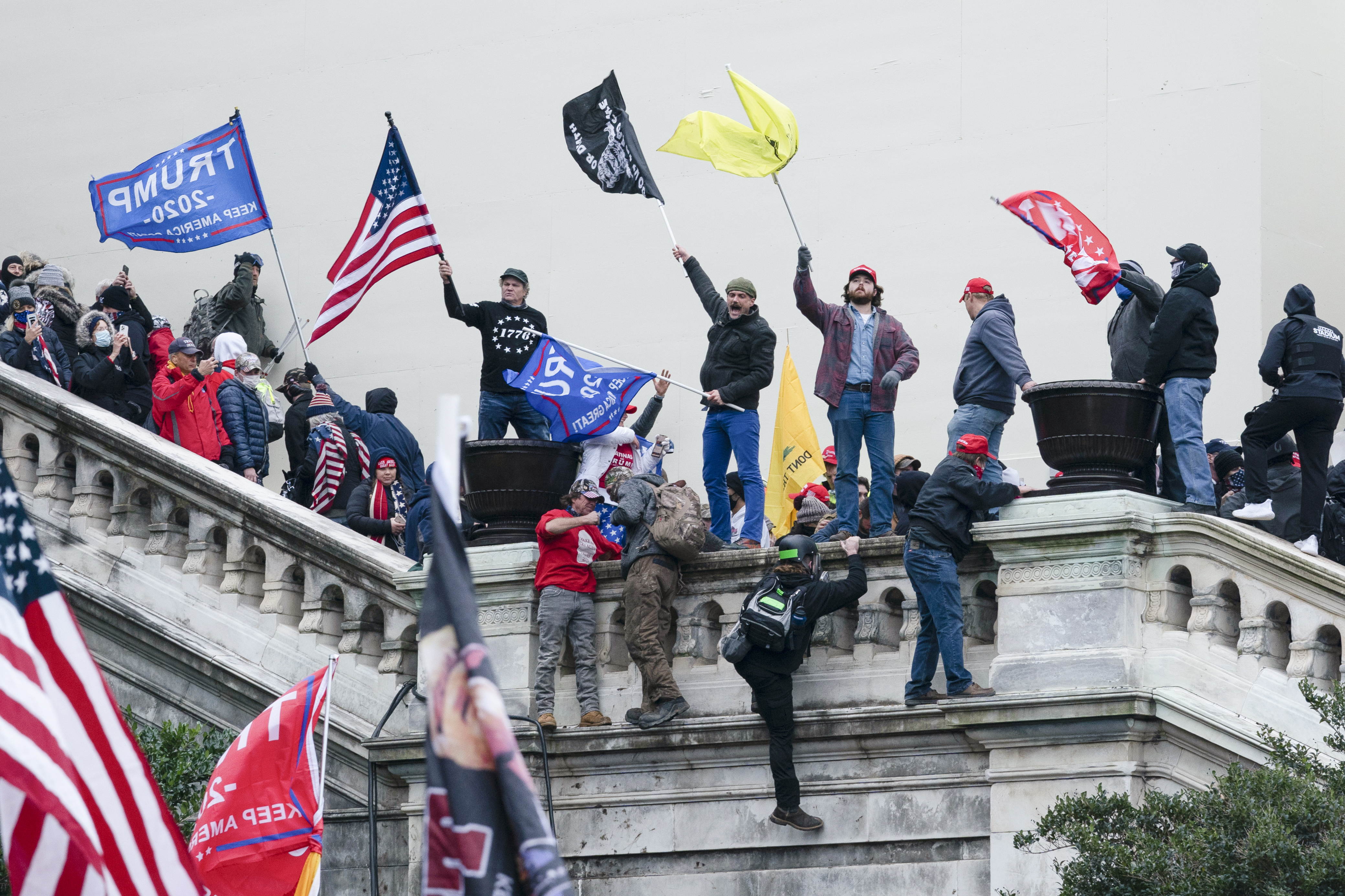 Rioters wave flags on the West Front of the U.S. Capitol in Washington on Jan. 6, 2021. Photo / AP
