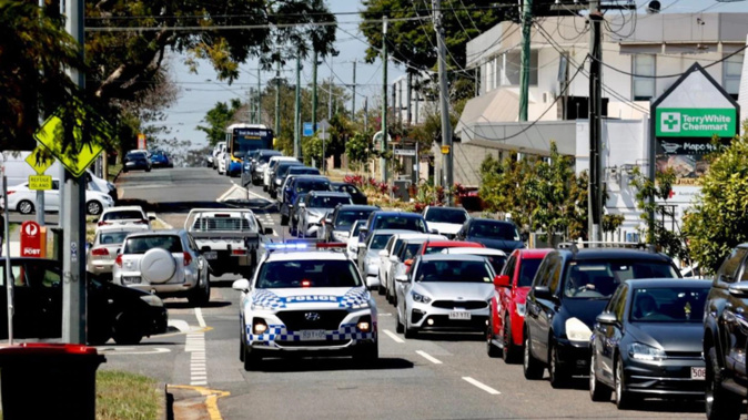 Parents queue to pick up their kids from St Thomas More College in Sunnybank, Brisbane. (Photo / NCA NewsWire)