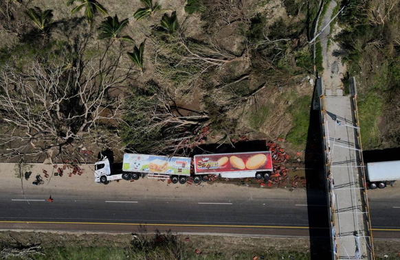 An overturned truck lays on the shoulder of a highway in the aftermath of Hurricane Otis, on the outskirts of Acapulco. Photo / AP