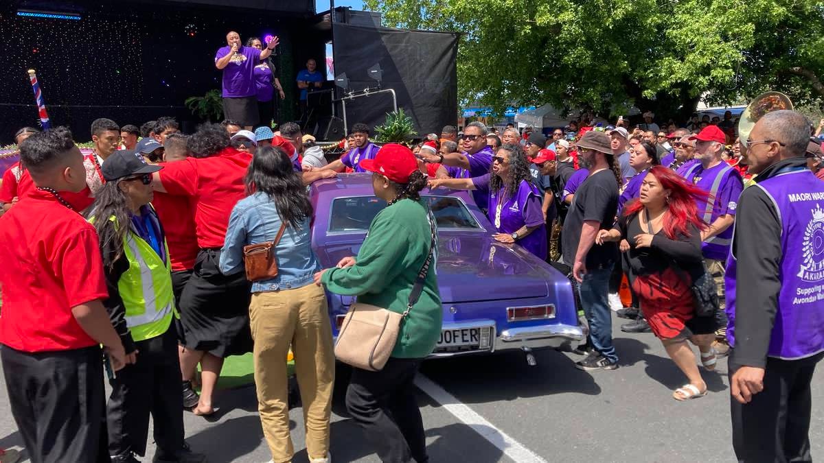 A BurgerFuel car collided with a brass band at the Avondale Santa parade. Photo / Michael Burgess