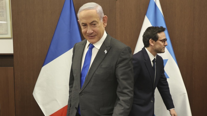 Israeli Prime Minister Benjamin Netanyahu, left, takes a seat before his meeting with France's Foreign Minister Stephane Sejourne, right, in Jerusalem Monday, Feb. 5, 2024. 5, 2024. Photo / Gil Cohen-Magen/Pool via AP