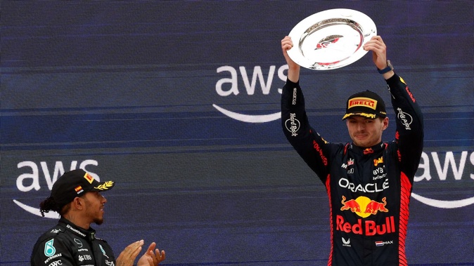 Mercedes driver Lewis Hamilton applauds winner Red Bull driver Max Verstappen. Photo / AP