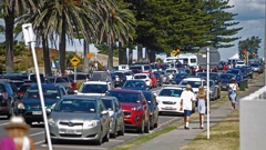 Slow traffic and a lack of parking spaces is a typical scene at Mount Maunganui during summer. Photo / George Novak