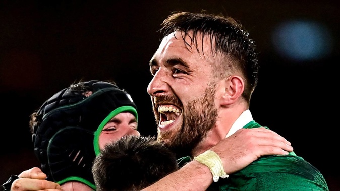 Ireland players, from left, James Ryan, Conor Murray and Jack Conan celebrate after their side's victory over the All Blacks. Photo / Getty