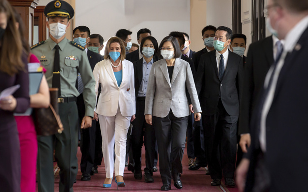 House Speaker Nancy Pelosi, center left, and Taiwanese President President Tsai Ing-wen arrive for a meeting in Taipei, Taiwan