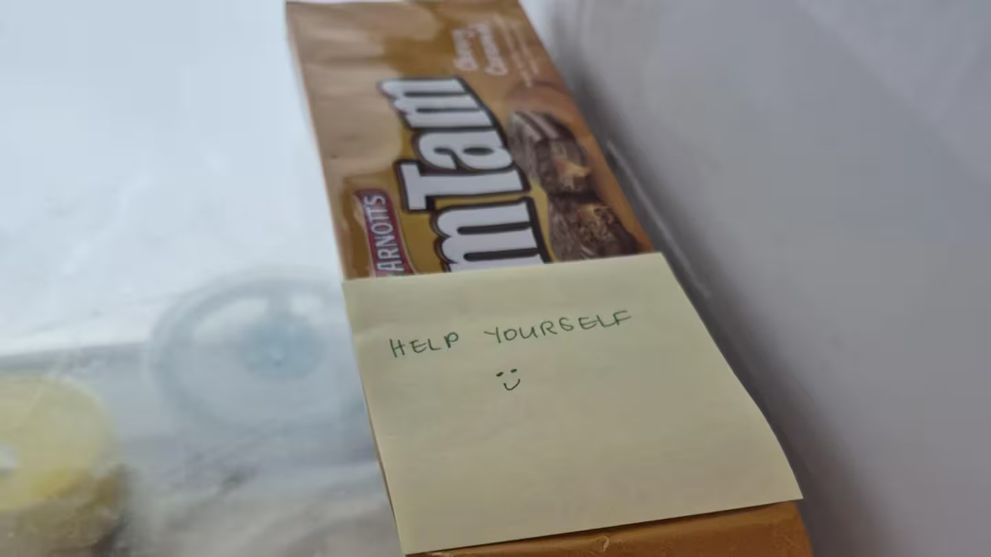 'Diabolical': Simple note on packet of Tim Tam's in work fridge sparks outrage