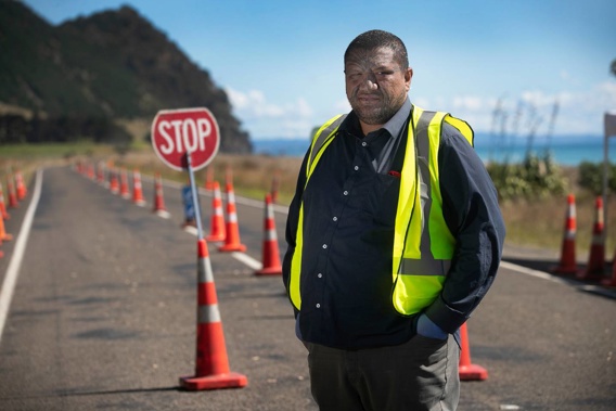 Community leader Louis Rapihana pictured at the roadblock he and his people have set up on State Highway 35 near Hawai on the East Coast last year. Photo / Alan Gibson