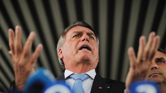 A Brazilian judge declared ex-president Jair Bolsonaro a 'flight risk' and placed him under round-the-clock watch. Photo / Sergio Lima, AFP