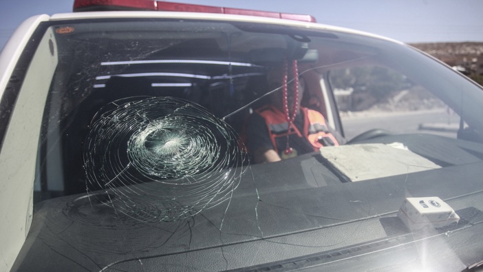 An ambulance belonging to the Palestinian Medical Relief Society, its windows were smashed, and stoned by Israeli settlers while on duty near the Evitar outpost in the town of Beita, south of Nablus in the West Bank. Photo by Nasser Ishtayeh/SOPA Images/LightRocket via Getty Images