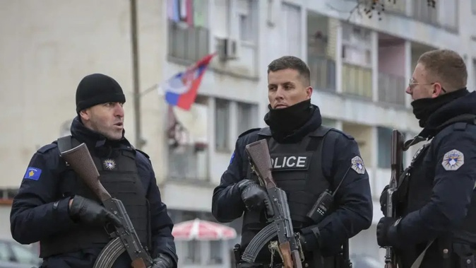Kosovo police officers patrol in a mixed community neighbourhood of the ethnically divided town of Mitrovica, in northern Kosovo. Photo / AP