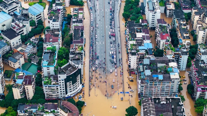 Aerial view of houses and tress submerged in flood waters on June 20, 2024 in Guilin, Guangxi Zhuang Autonomous Region of China. VCG/Getty Images
