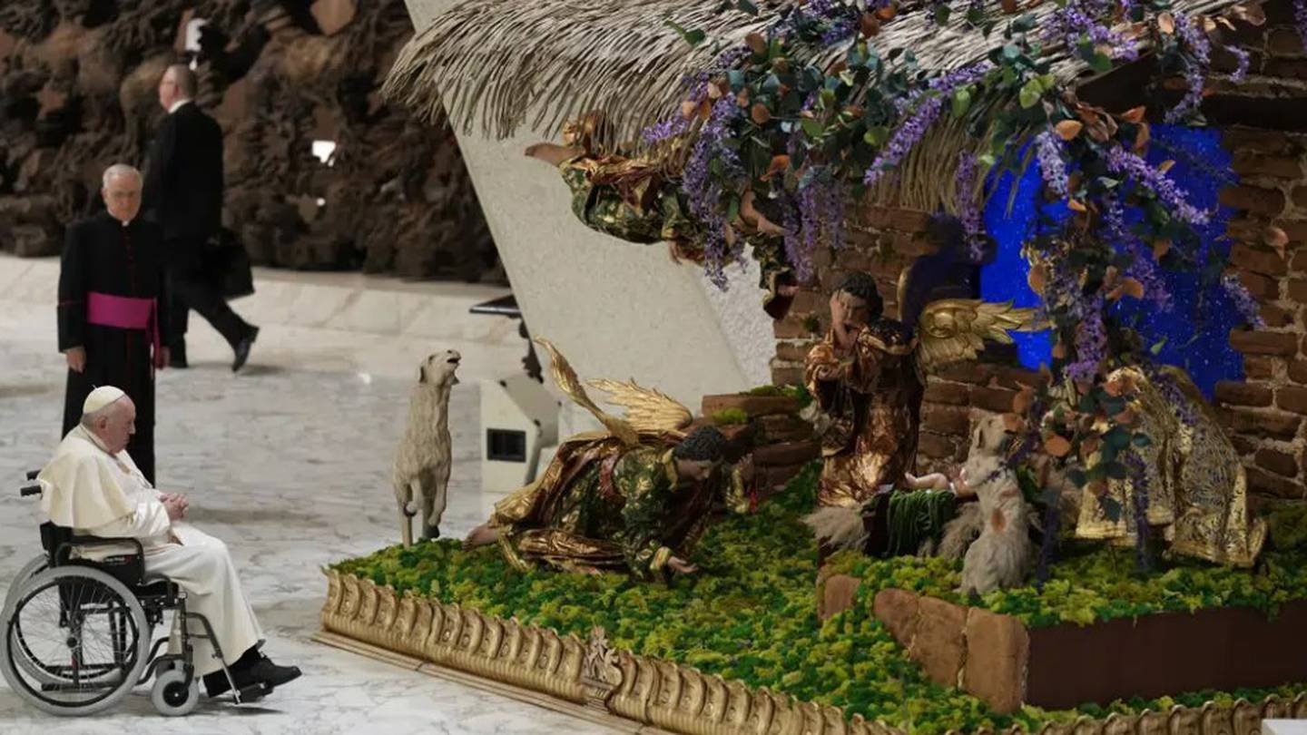 Pope Francis looks at a nativity scene as he leaves after his weekly general audience in the Paul VI Hall, at the Vatican. Photo / AP