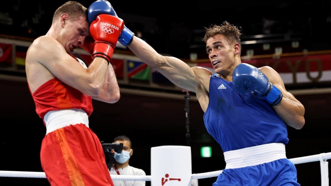 David Nyika lands a punch against Uladzislau Smiahlikau. Photo / Getty