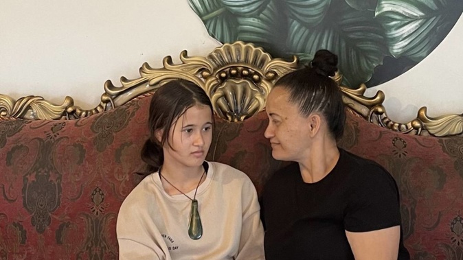 Keavarni Caffery with her mum Toni Paikea, who wants to know why her daughter was forced to cut off her taonga at school. Photo / Joseph Los'e