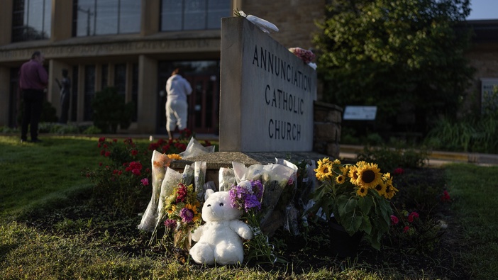 Memorials begin to fill the sidewalks near Annunciation Catholic Church in Minneapolis, Minn., on Thursday, August 28, 2025. (Photo by Elizabeth Flores/The Minnesota Star Tribune via Getty Images)