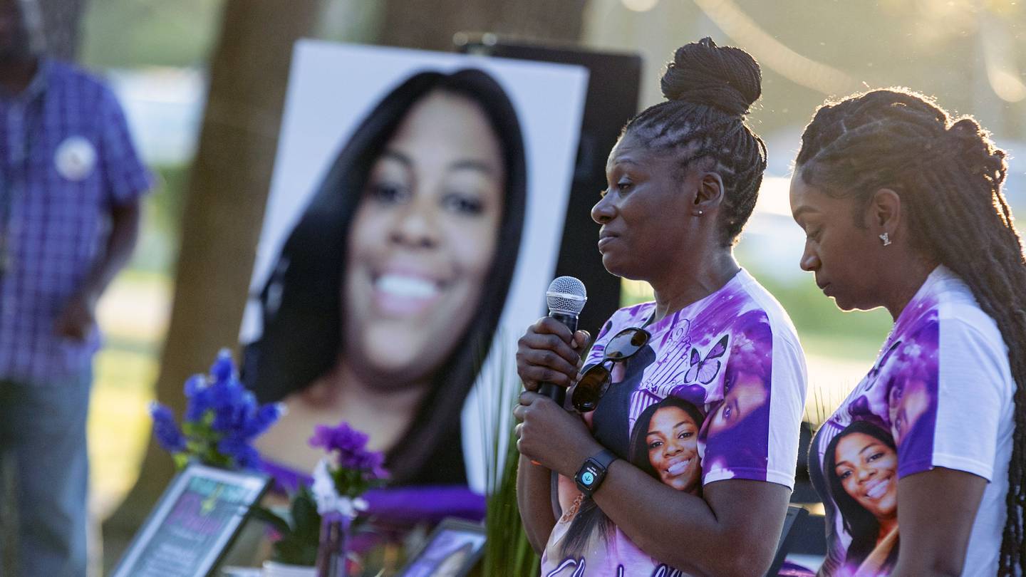 Pamela Dias, second from right, remembers her daughter, Ajike Owens, as mourners gather for a remembrance service. Photo / AP