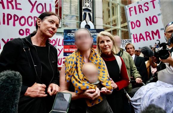 Anti-vaccination protesters last week outside the Auckland High Court after a hearing over blood needed for a 4-month-old baby who requires urgent surgery. (Photo / Alex Burton)