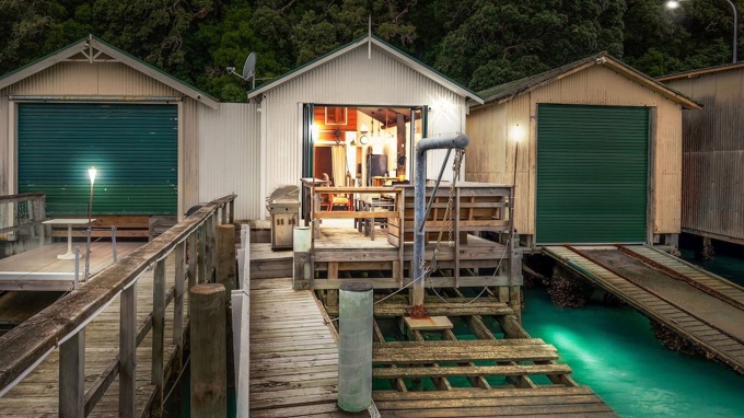 Aucklander convicted of tax charges wins right to build beside heritage-protected boat sheds