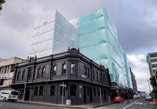 Kate Sheppard apartments in Wellington with protective wrapping while undergoing earthquake repairs last year. Photo / Mark Mitchell, File