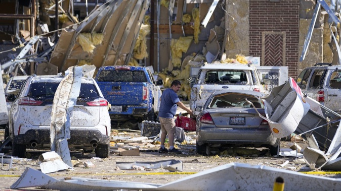 A man looks at a damaged car after a tornado hit the day before, Sunday, May 26, 2024, in Valley View, Texas. Photo / AP