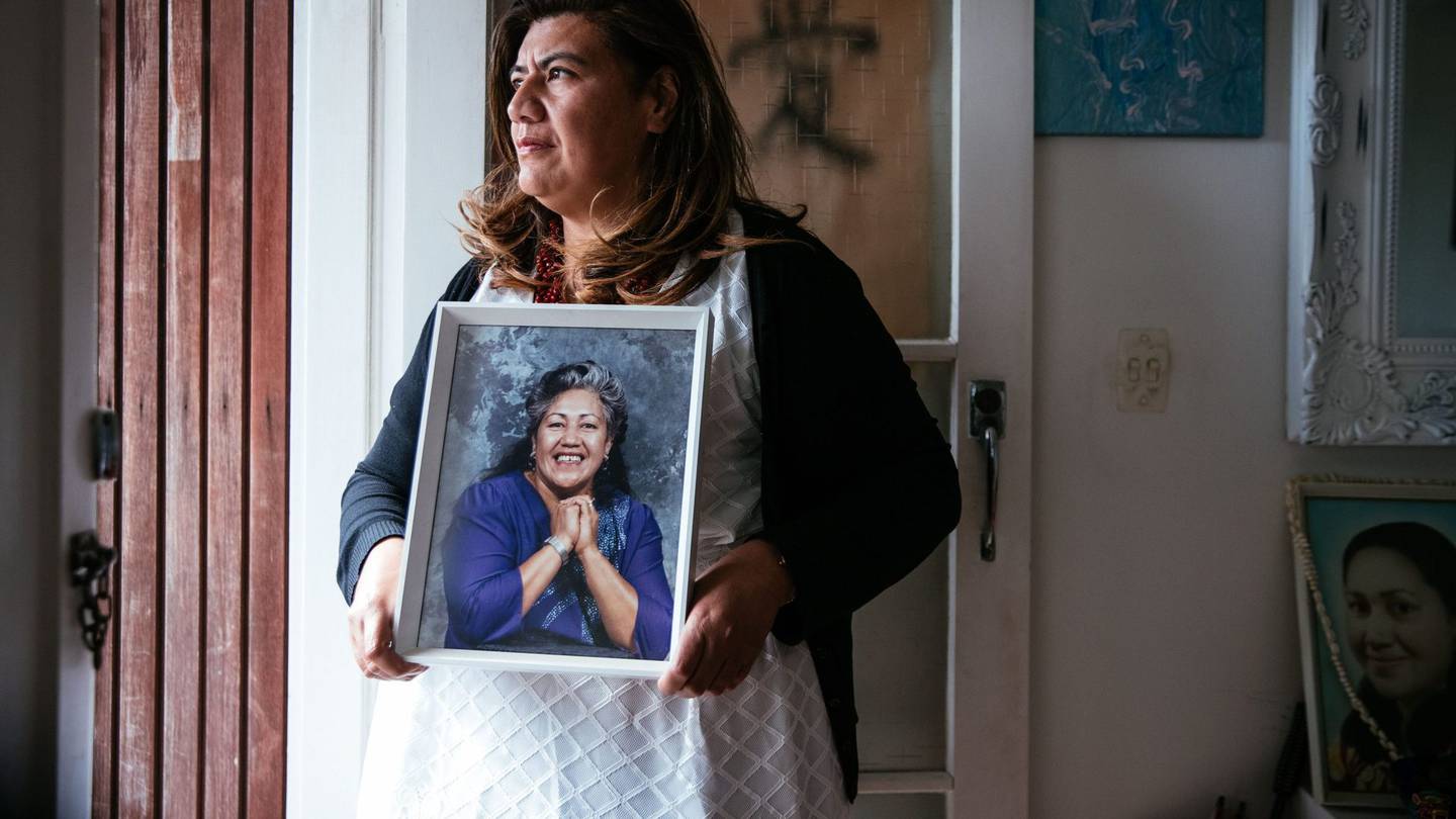 Auckland councillor Josephine Bartley with a picture of her mother Ruth, who she says had a chronic gambling problem. Photo / Abigail Dougherty
