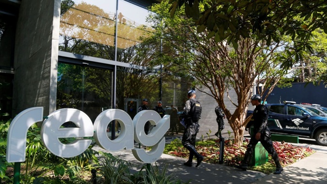 Brazilian police dismantled a criminal network defrauding motorists and laundering money for the First Capital Command. Photo / Miguel Schincariol, AFP