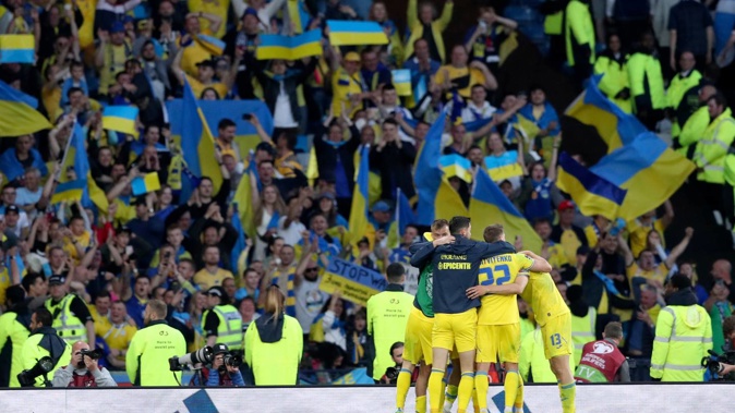 Ukrainian players celebrate at the end of the World Cup 2022 qualifying play-off. Photo / AP
