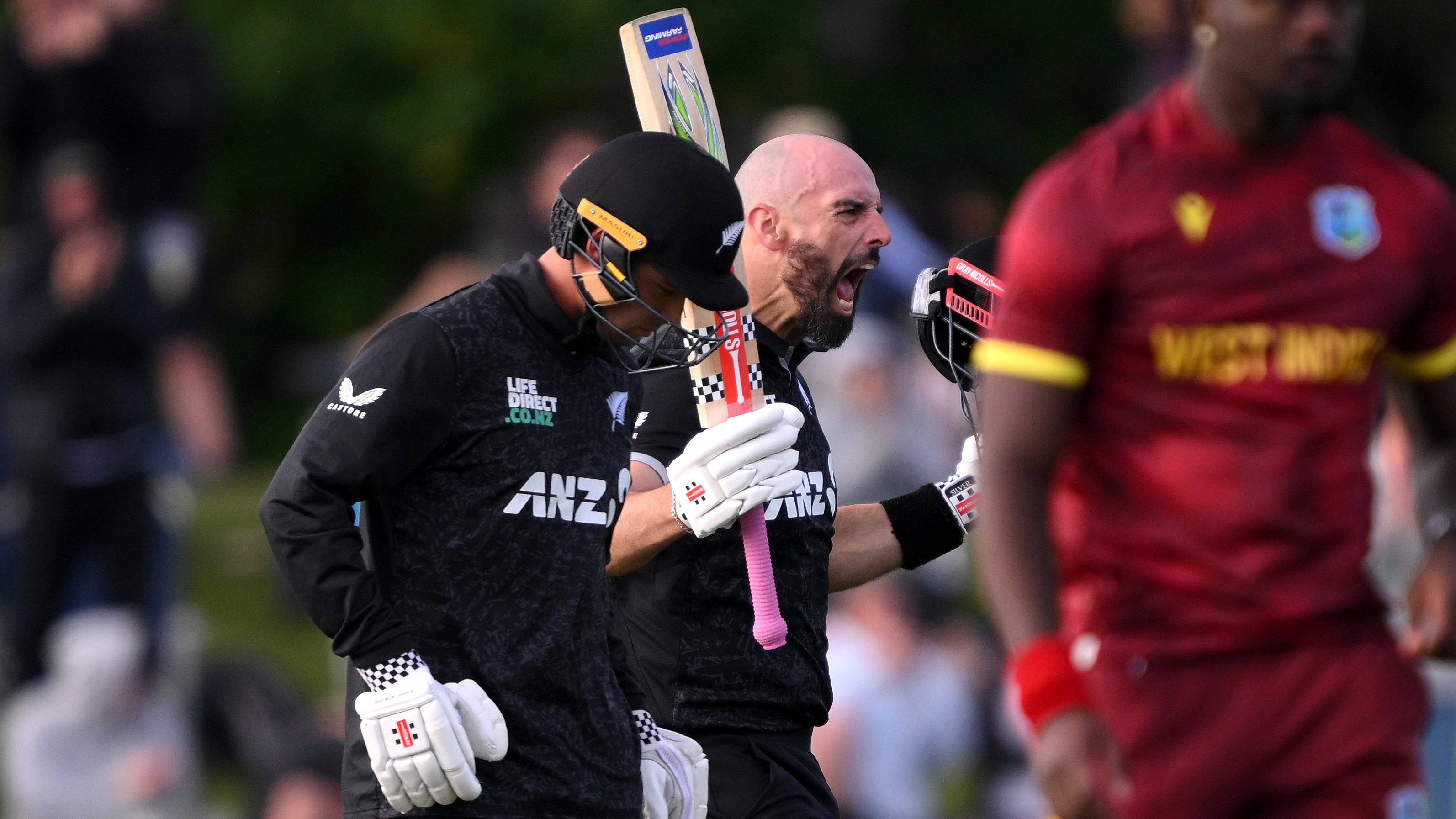  Daryl Mitchell of New Zealand celebrates after scoring a century during the First One Day International match in the series between New Zealand and New Zealand and West Indies at Hagley Oval on November 16, 2025 in Christchurch, New Zealand. (Photo by Joe Allison/Getty Images)