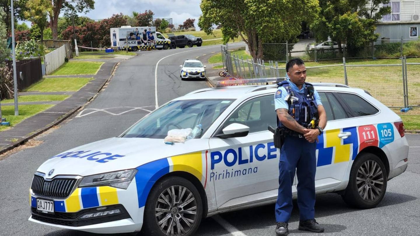 Police stand guard near the scene in a West Auckland reserve where a security guard was found dead on December 18. Photo / RNZ/Lucy Xia