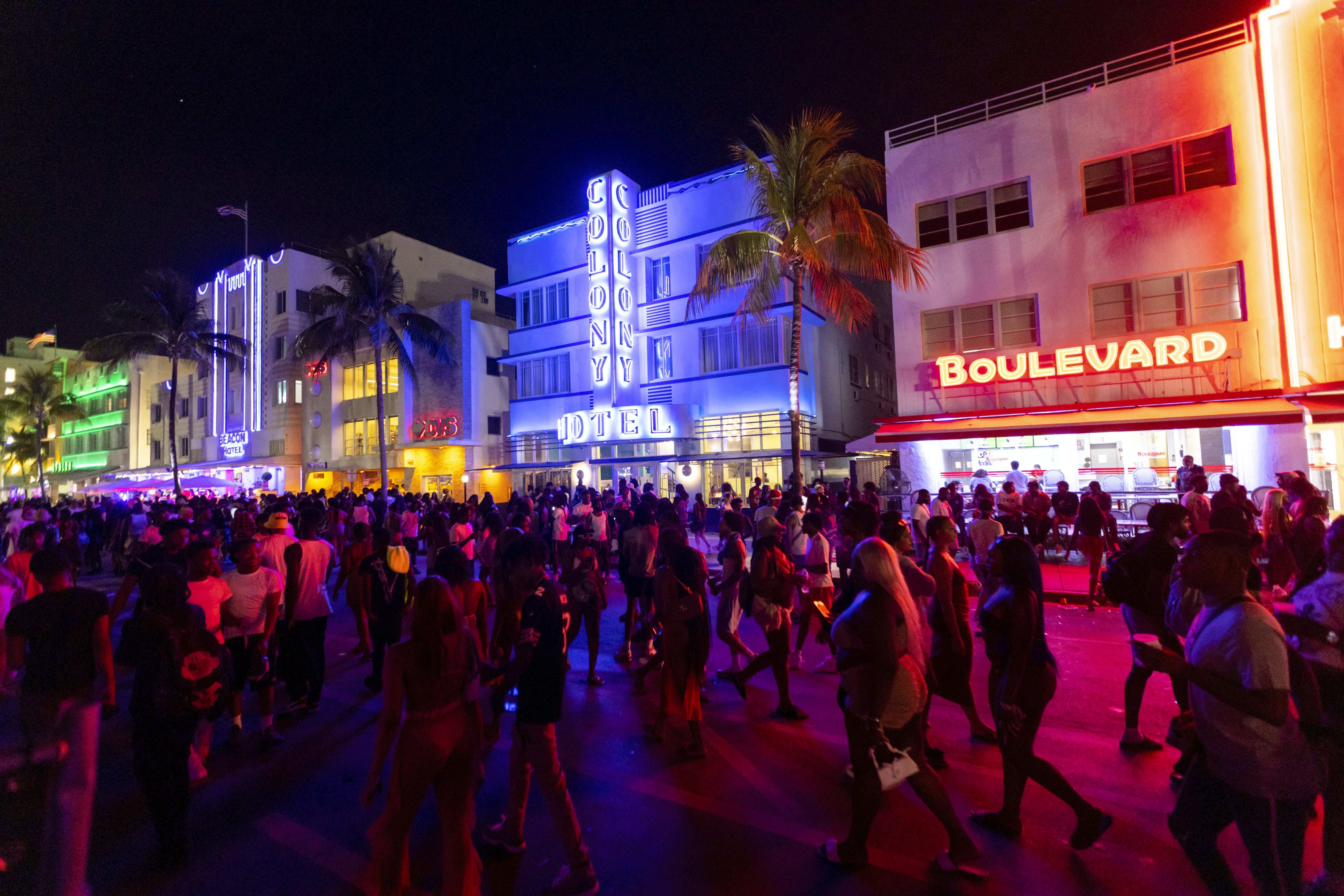 Crowds walk up and down Ocean Drive during spring break at Miami Beach. Photo / Miami Herald via AP