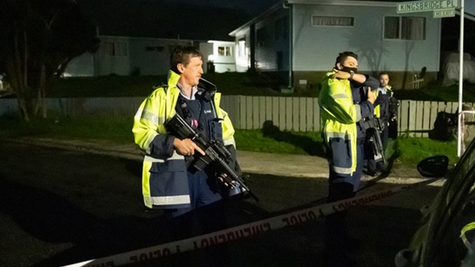 Armed police at their cordon on the corner of Kingsbridge Place and Colchester Crescent in Wellington. Photo / Mark Mitchell