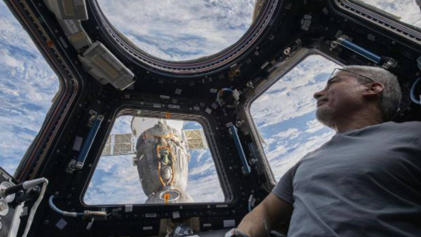 Mark Vande Hei peers at the Earth below from inside the seven-windowed cupola, the International Space Station's window to the world. (Photo / AP)