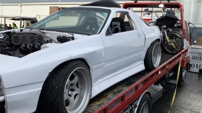 Police seized four vehicles including a Harley-Davidson motorcycle and about $80,000 cash during Operation Poapoa in 2022. Photo / NZ Police