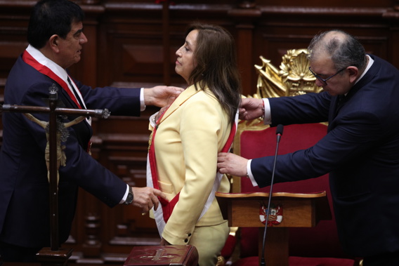 Former Vice President Dina Boluarte receives the presidential sash as she is sworn-in as the new president of Peru. Photo / AP