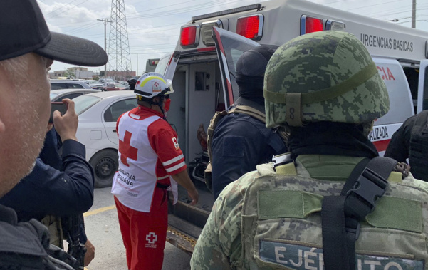 A Red Cross worker closes the door of an ambulance carrying two Americans found alive after their abduction in Mexico. Photo / AP