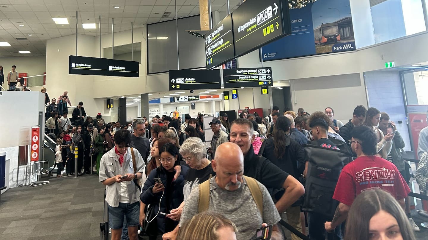 Large queues at Auckland Airport after two Air NZ flights were cancelled due to the fault.