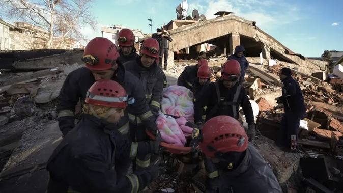 Rescue teams evacuate a survivor from the rubble of a destroyed building in Kahramanmaras, southern Turkey. Photo / AP