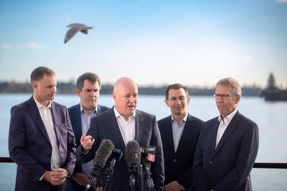 National leader Christopher Luxon discusses his party's new renewables policy with MPs, from left, Simon Watts, Chris Bishop, Simeon Brown and Stuart Smith. Photo / Michael Craig