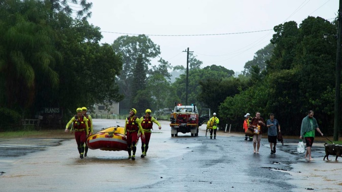 Queensland Fire and Emergency volunteers preparing for flooding as torrential rain continues to fall in Southern Queensland. Photo / QFES