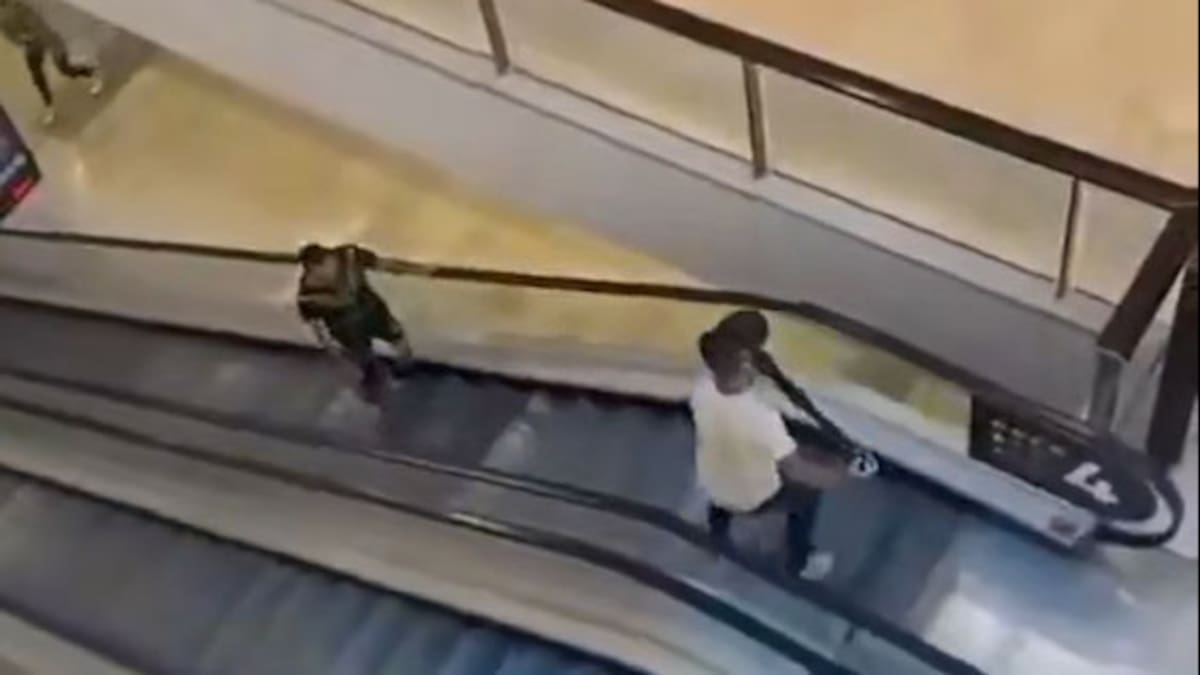 Damien Geurot Wielding A Bollard Attempts To Stop Joel Cauchi On His Rampage.