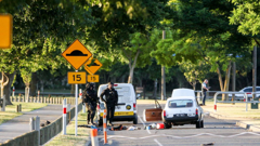 Police and the stolen car, bonnet up, at Park Island as a standoff with the gunman started early-evening on December 10, 2019. (Photo / NZME)