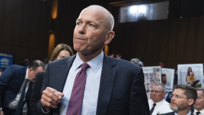 Boeing CEO Dave Calhoun takes his seat to testify before the Senate Homeland Security and Governmental Affairs Subcommittee on Investigations to answer to lawmakers about troubles at the aircraft manufacturer since a panel blew out of a Boeing 737 Max during an Alaska Airlines flight in January. (AP Photo/Manuel Balce Ceneta)