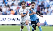 Callan Elliot of Auckland FC is challenged by Sydney FC's Tiago Quintal during the round 26 A-League Men match between Sydney FC and Auckland FC at Allianz Stadium, on April 26, 2026, in Sydney, Australia. (Photo by Steve Christo - Corbis/Corbis via Getty Images)