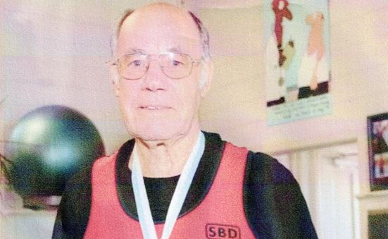 Bernard Collins wearing one of his medals. Photo / Supplied